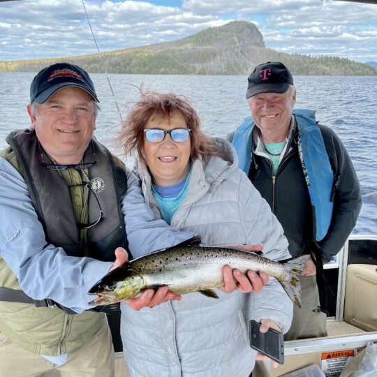 Family enjoying guided fishing trip