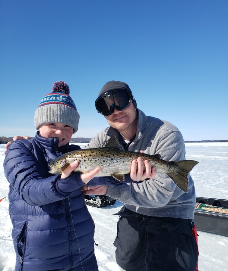 Kid with his ice fishing catch