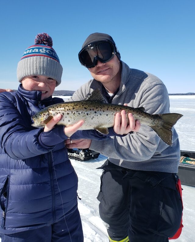 Kid with his ice fishing catch